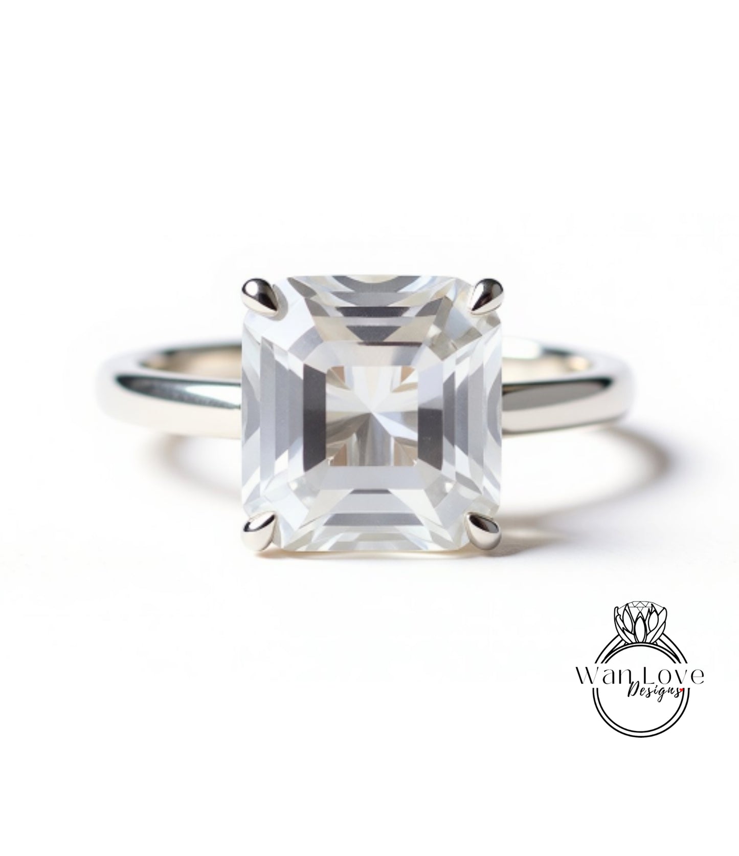A large, clear gemstone engagement ring with a silver band.