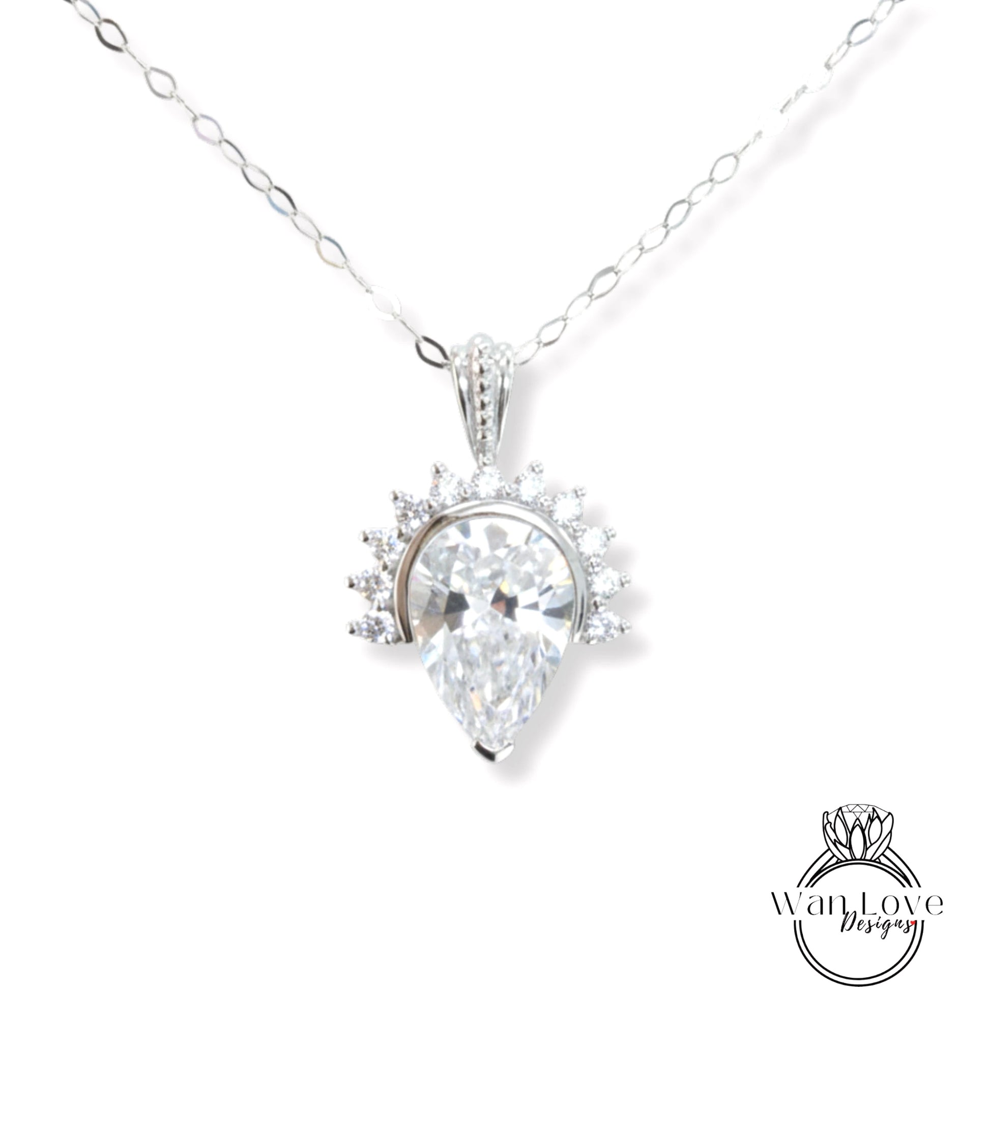 A necklace with a large, clear gemstone pendant, which appears to be a diamond.