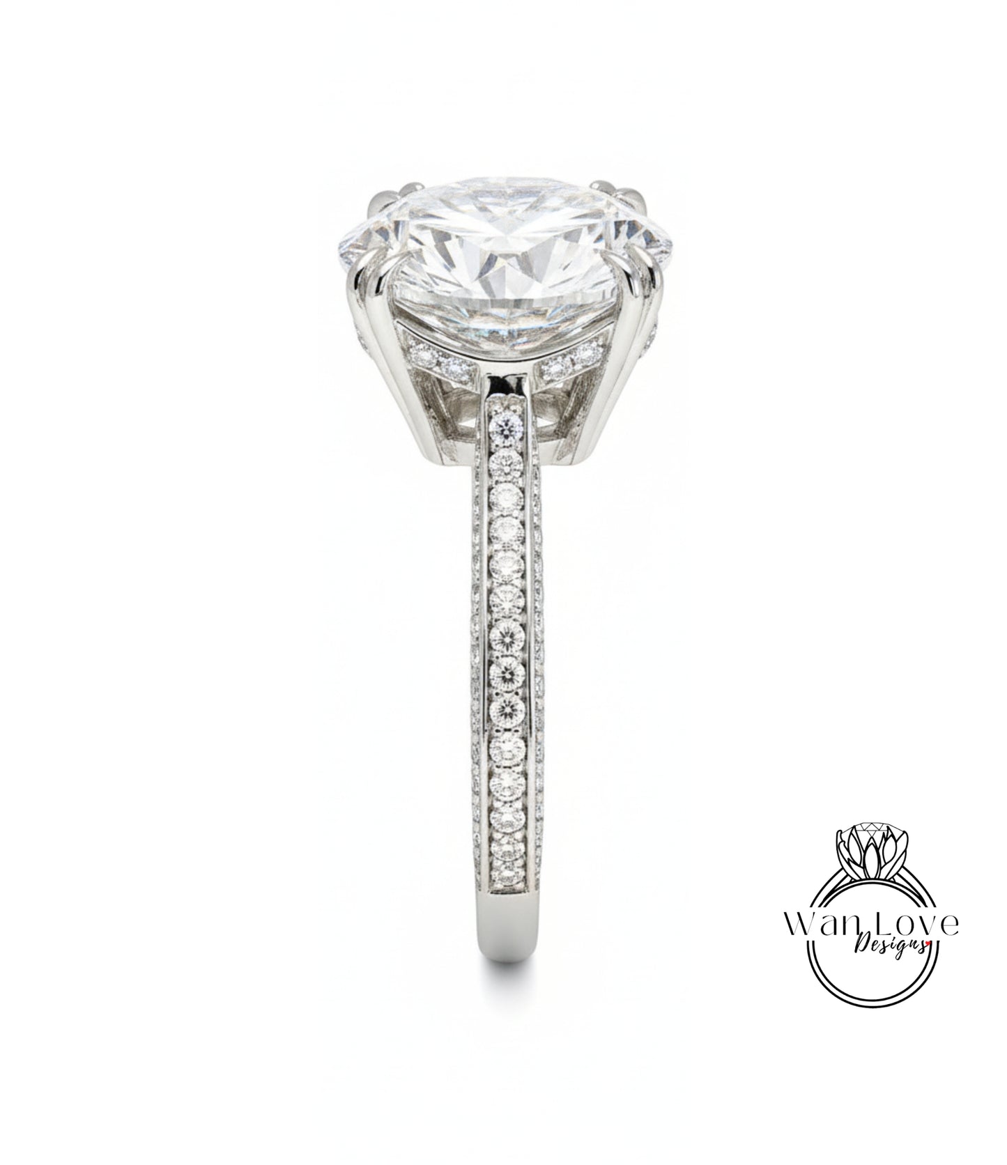A large, elegant diamond engagement ring with a prominent central diamond surrounded by smaller diamonds on the band.