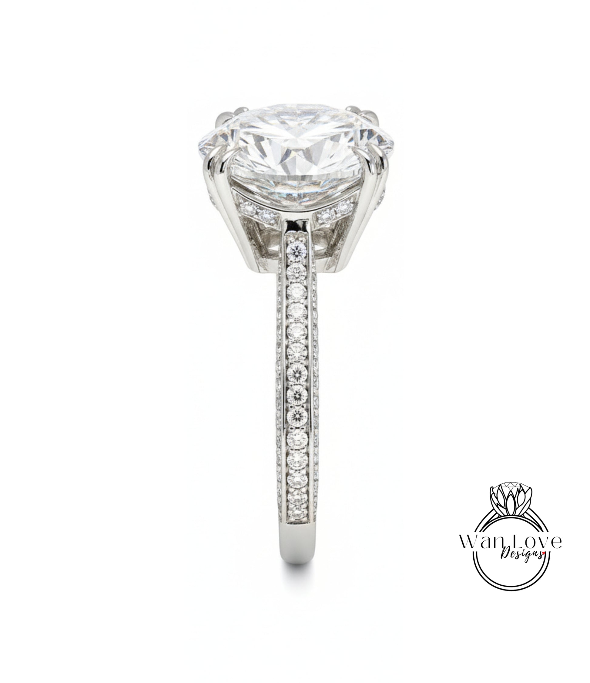 A large, elegant diamond engagement ring with a prominent central diamond surrounded by smaller diamonds on the band.