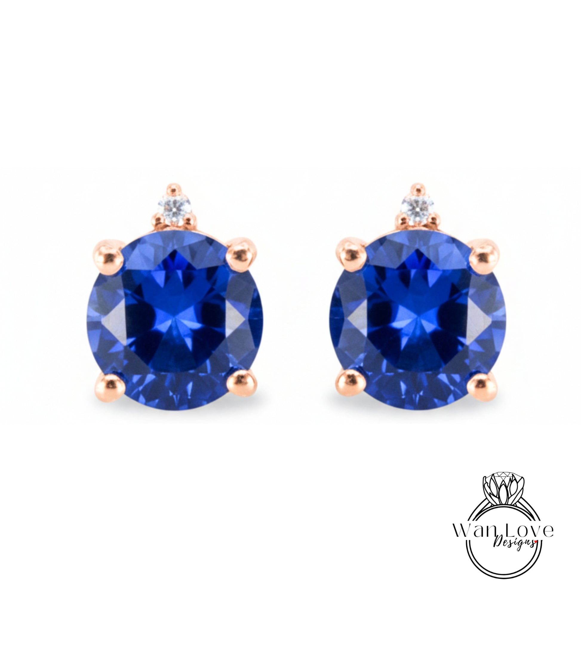 A pair of blue gemstone earrings with a rose gold accent, featuring a large blue gemstone in the center.