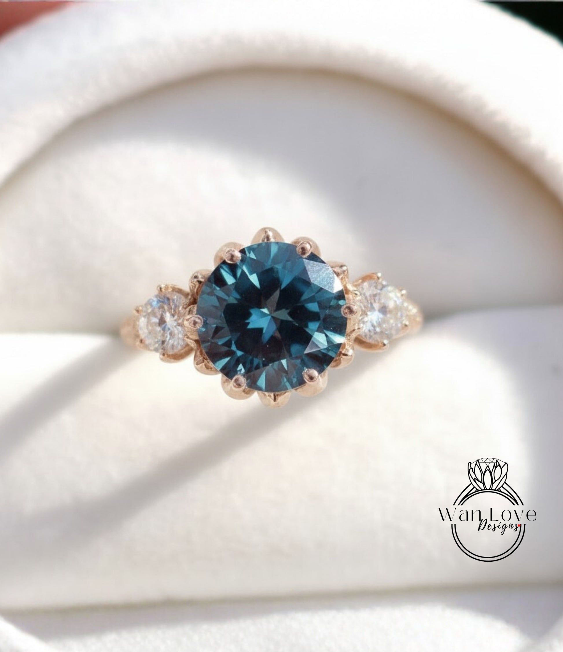 A close-up image of a gold ring with a large blue gemstone, showcasing the intricate details and craftsmanship of the jewelry.