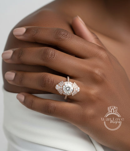 A close-up of a person's hand wearing a large, ornate diamond ring on the ring finger.