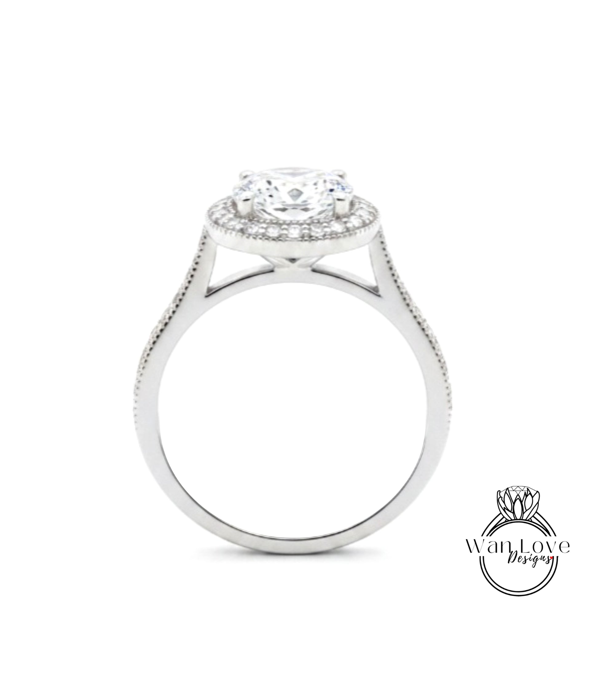 A silver engagement ring with a large central diamond surrounded by smaller diamonds, set in a halo of smaller diamonds.