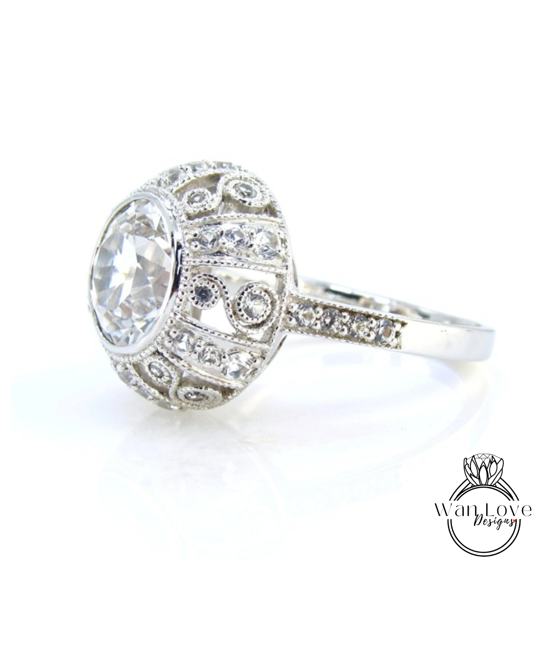 A close-up view of a diamond ring with a large central diamond surrounded by smaller diamonds and intricate metalwork.