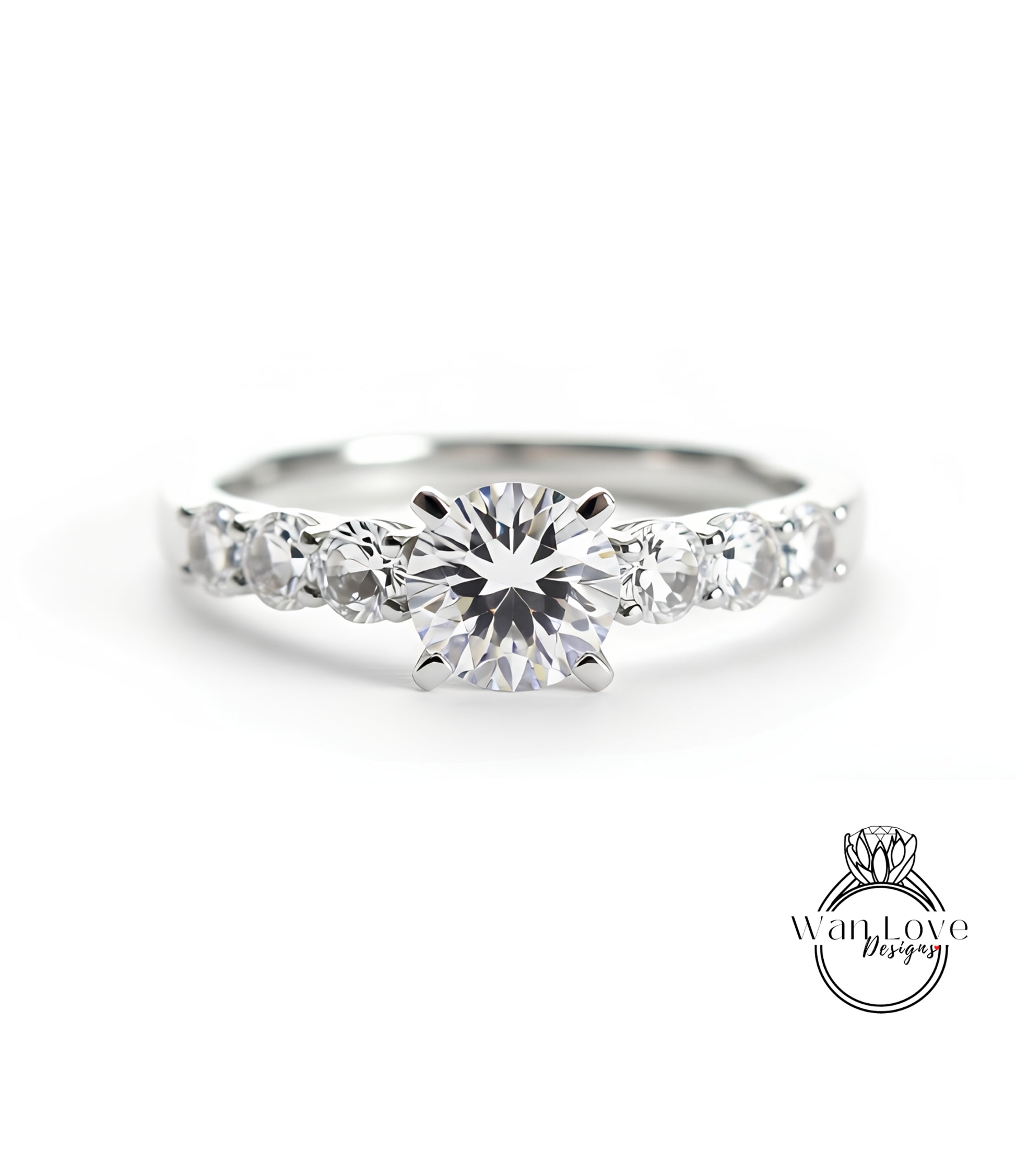 A close-up view of a diamond engagement ring with a large central diamond surrounded by smaller diamonds on either side.