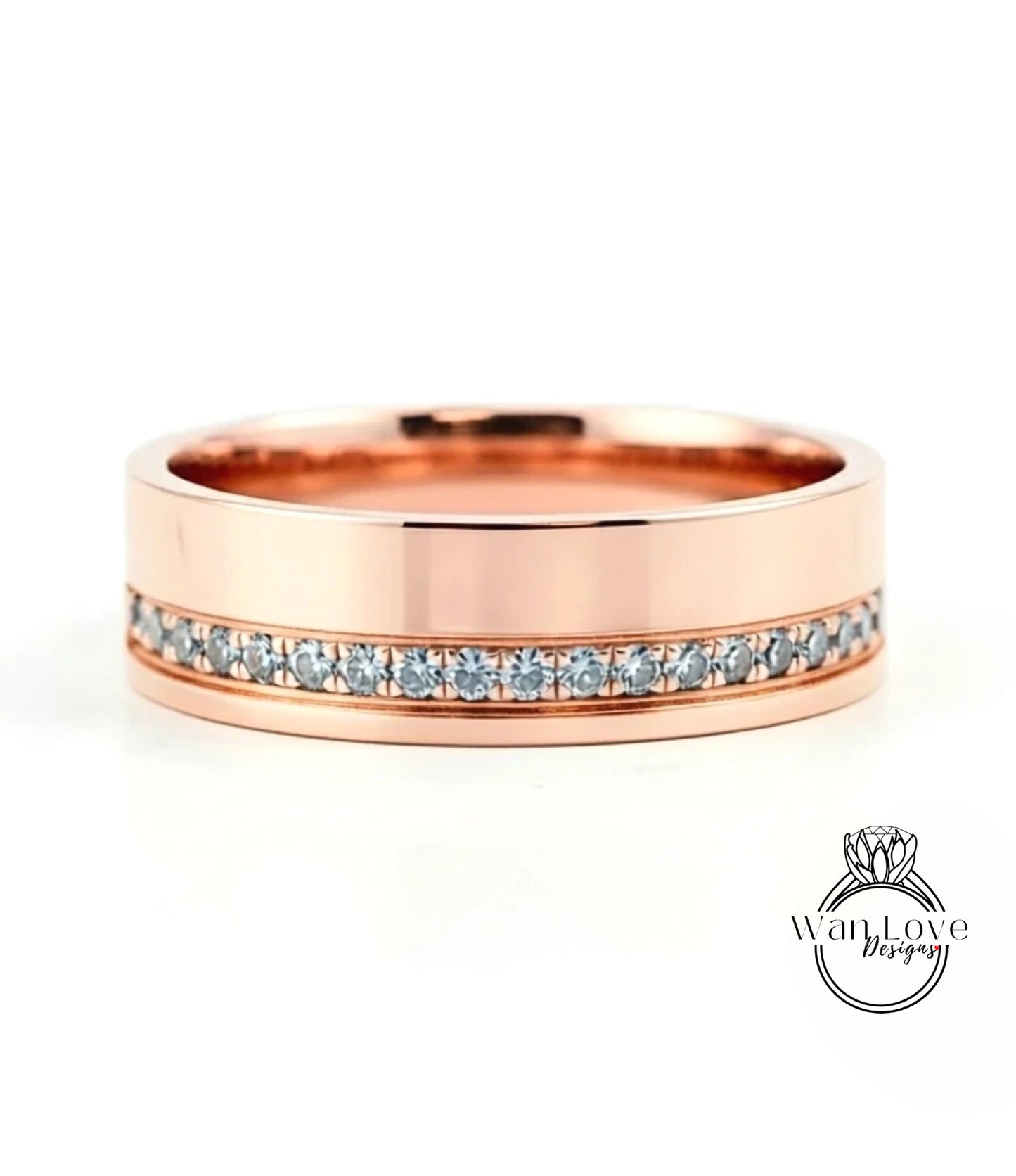 A rose gold wedding band with a row of small diamonds set along the inside edge.