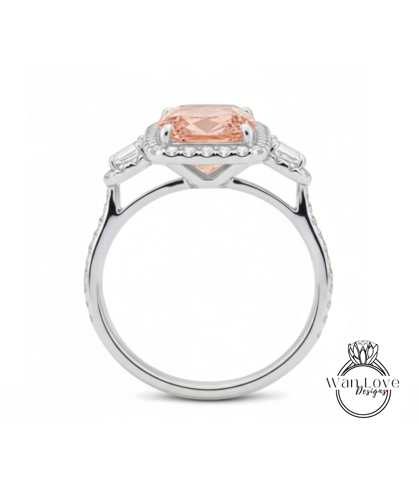 A silver ring with a large, peach-colored gemstone set in the center, surrounded by smaller diamonds.