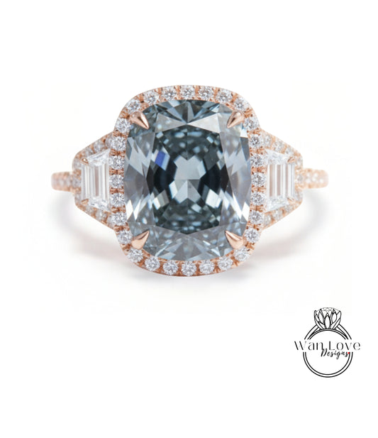 A large, blue diamond ring with a halo of smaller diamonds around the center stone.