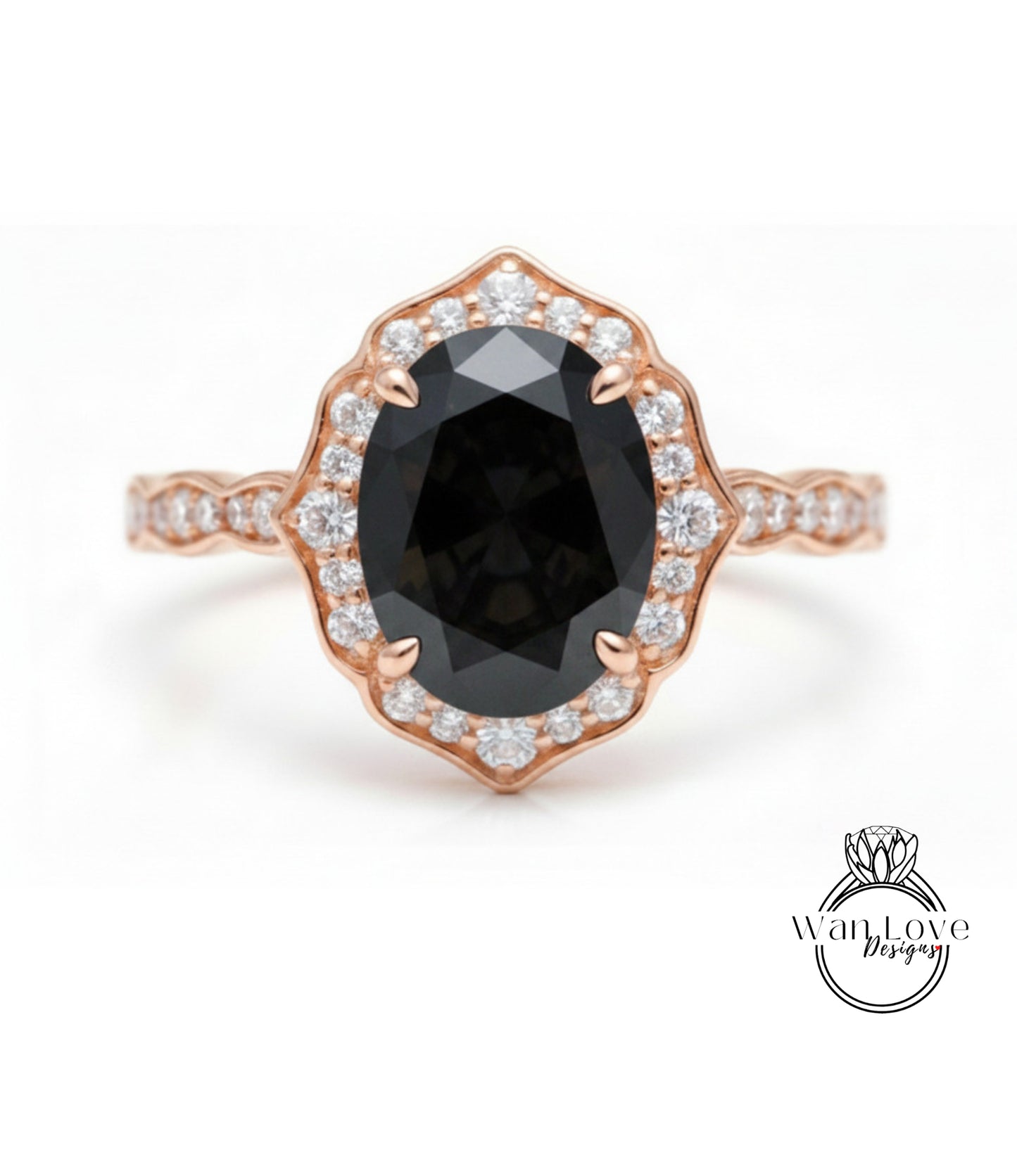 A rose gold ring with a large oval-shaped black gemstone set in a scalloped bezel, surrounded by smaller diamonds.