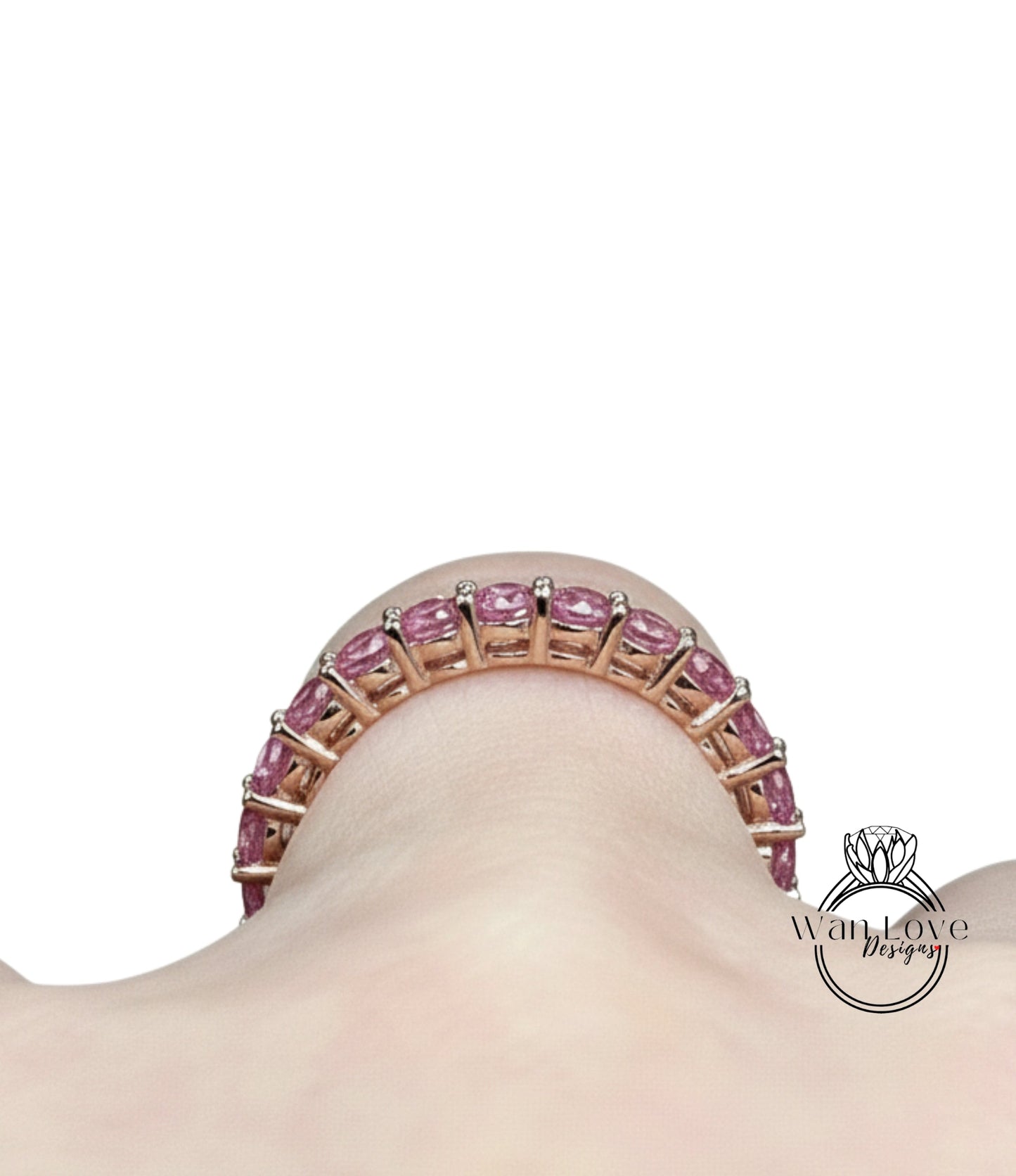 A close-up view of a person's neck and chest area, featuring a bracelet with a row of pink gemstones.