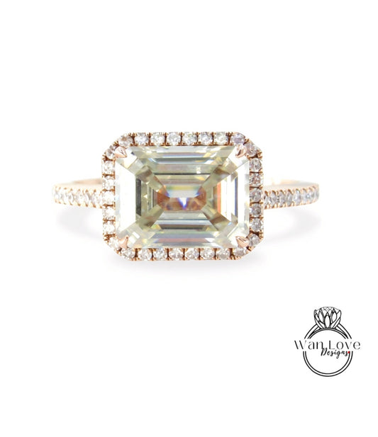 A large, square-cut diamond engagement ring with a halo of smaller diamonds around the center stone.