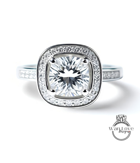 A stunning engagement ring with a large, brilliant-cut diamond set in a halo of smaller diamonds, surrounded by a silver band.