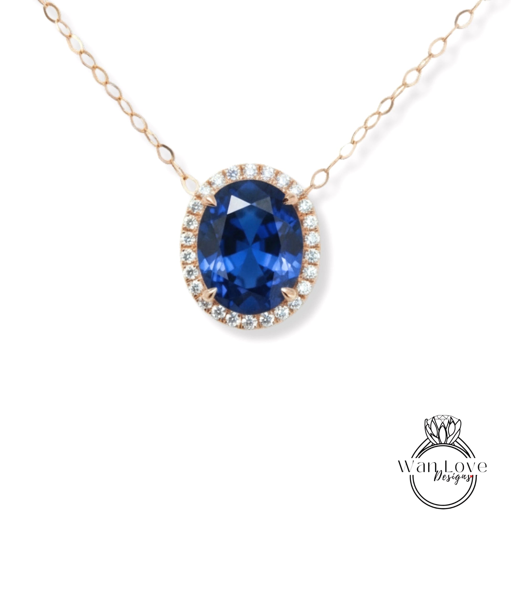 A necklace with a large oval-shaped blue gemstone surrounded by a halo of smaller diamonds.