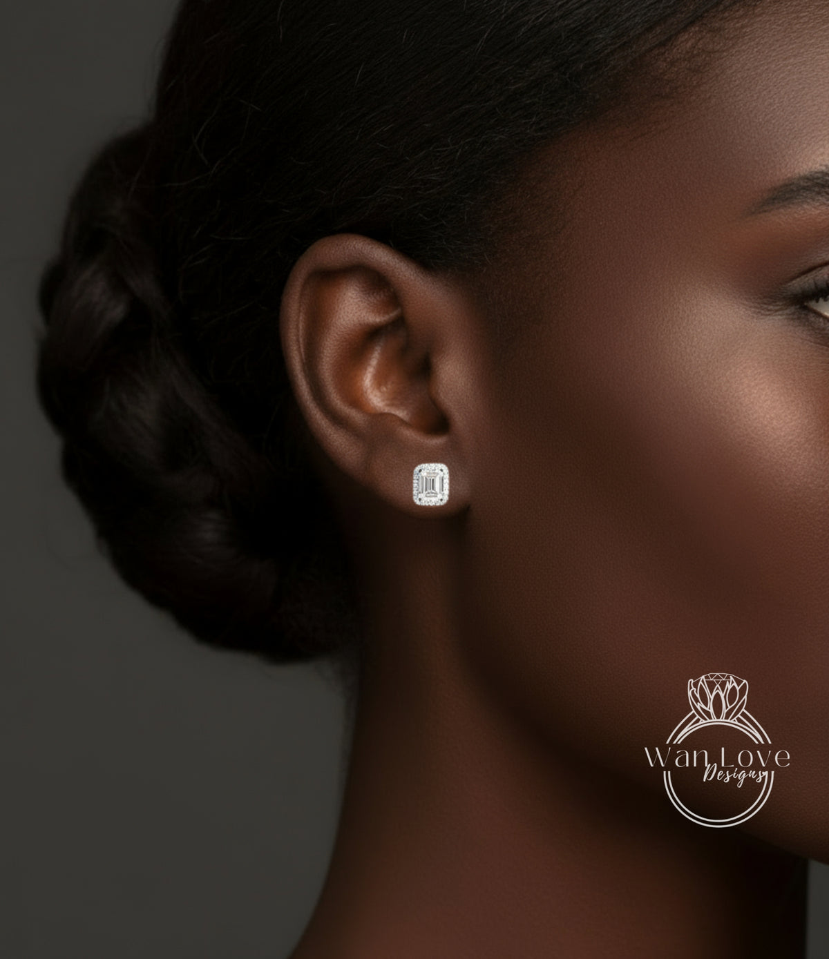A close-up of a woman's ear with a diamond earring, against a dark background.