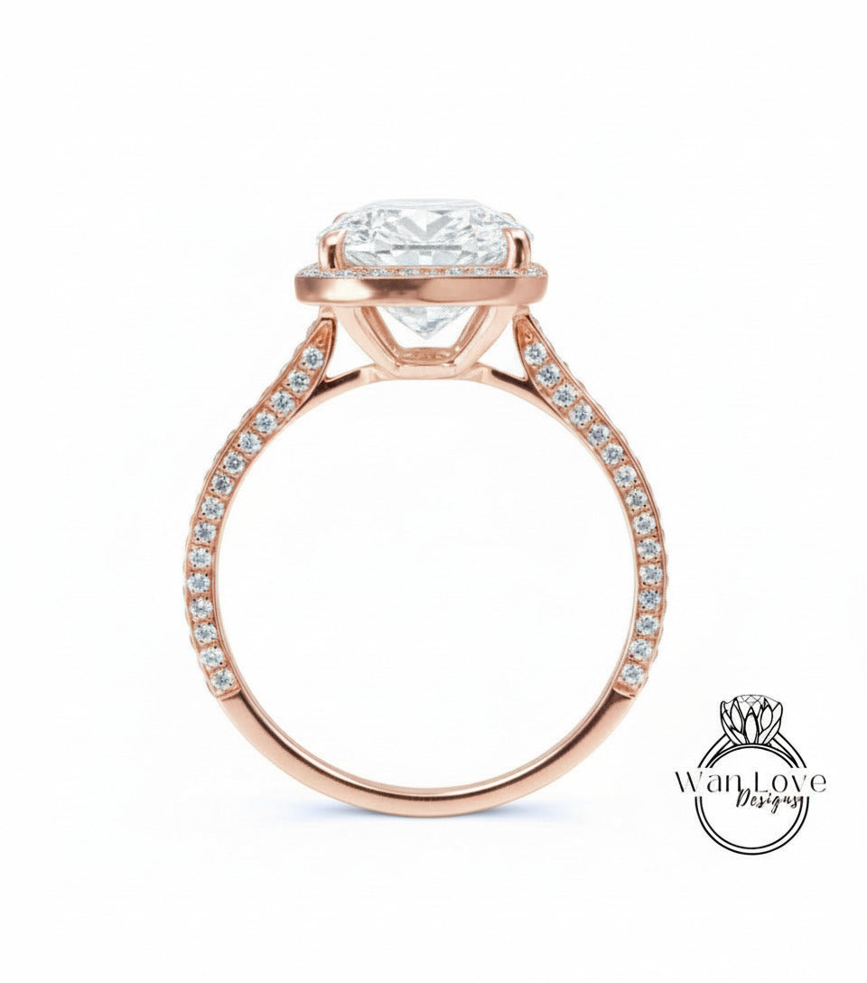 A rose gold engagement ring with a large, round diamond set in the center, surrounded by smaller diamonds along the band.