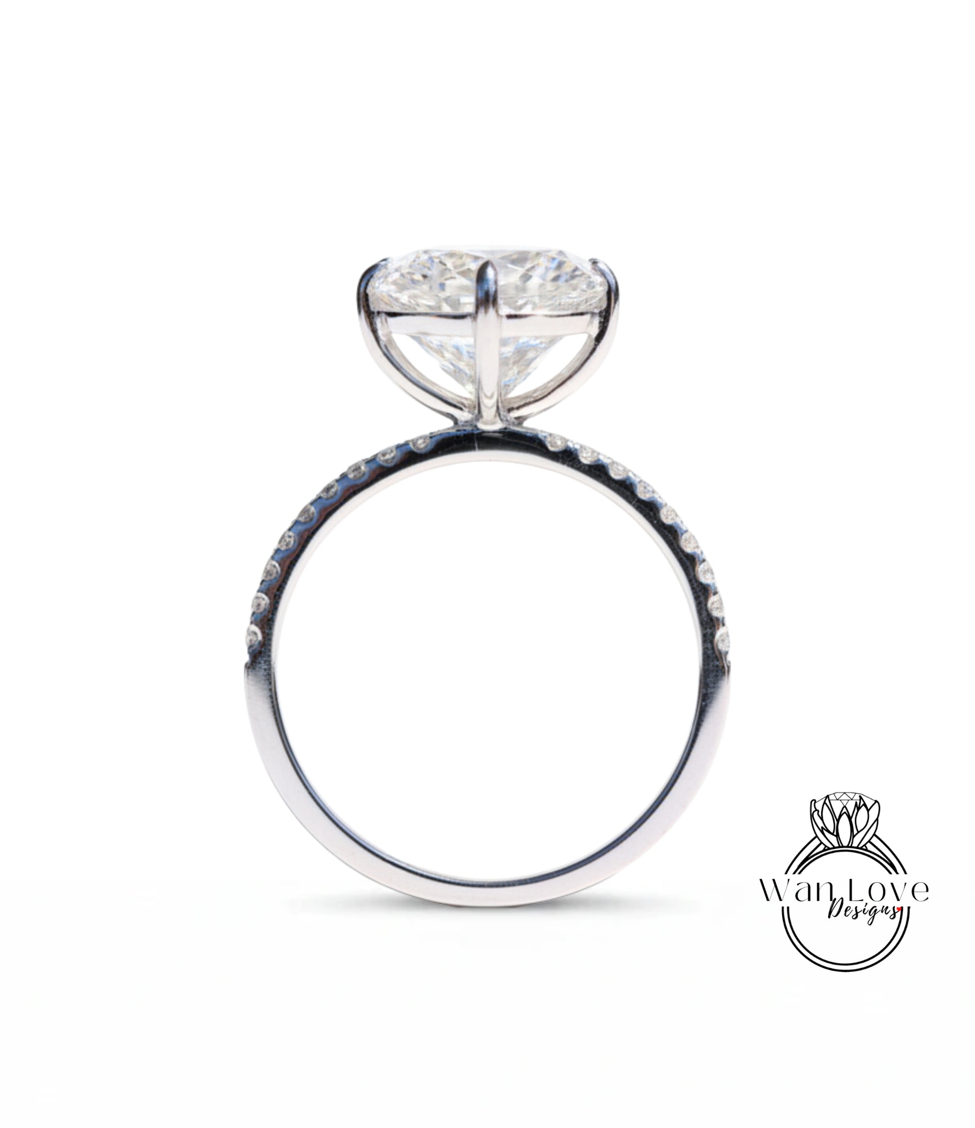 A close-up view of a silver engagement ring with a large, round diamond set in the center.