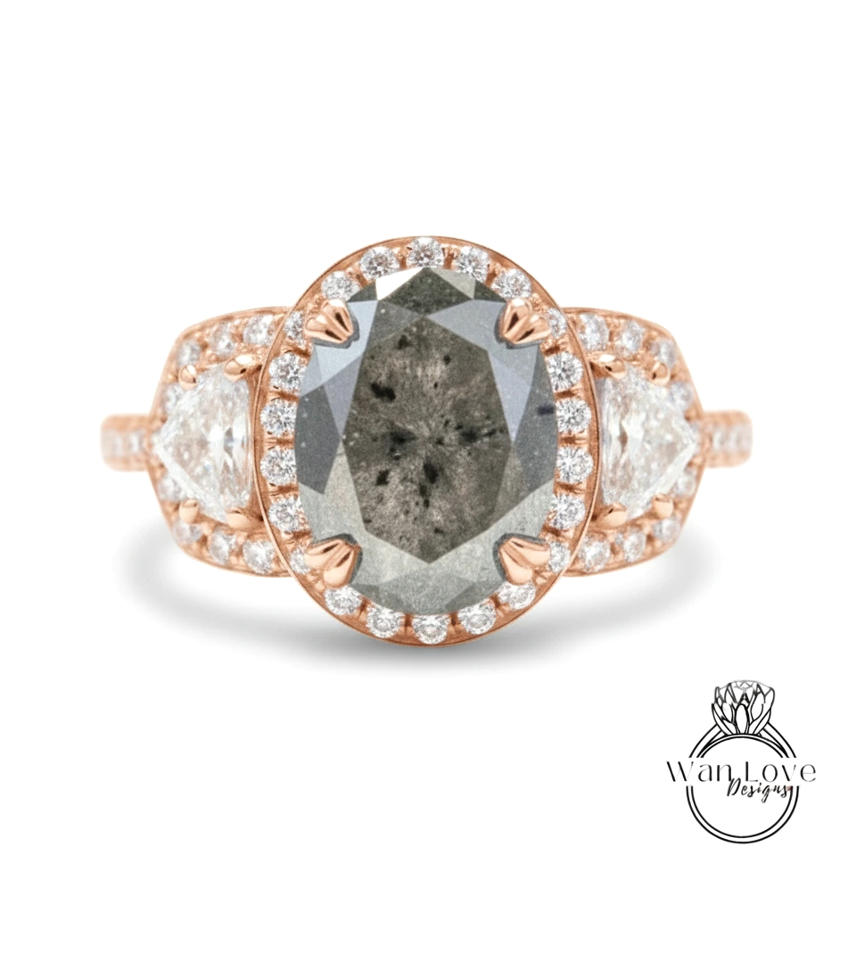 a beautiful ring with a large oval-shaped diamond at the center, surrounded by smaller diamonds and set in a rose gold band.