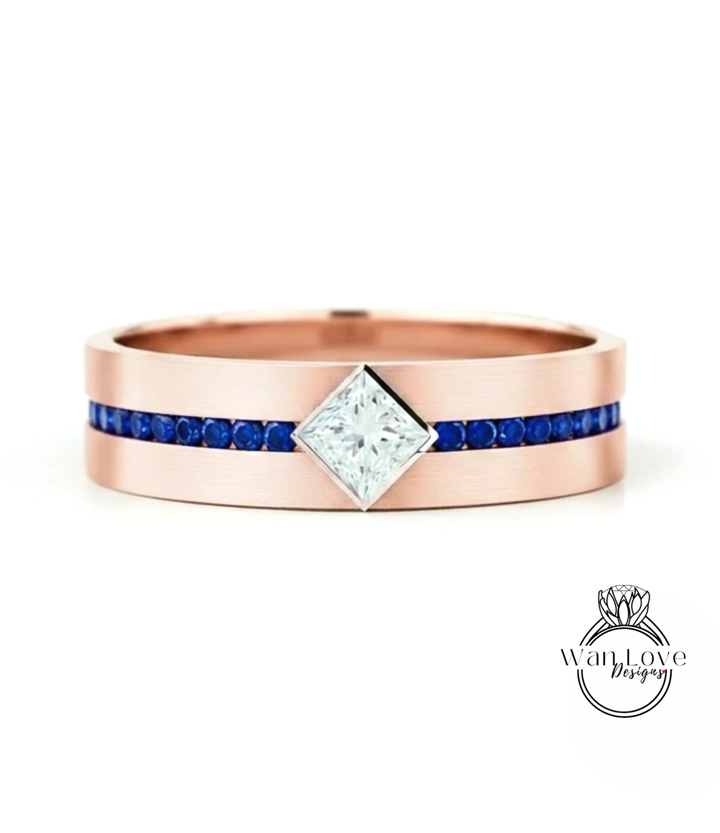 A rose gold ring with a large diamond set in the center, surrounded by blue gemstones.