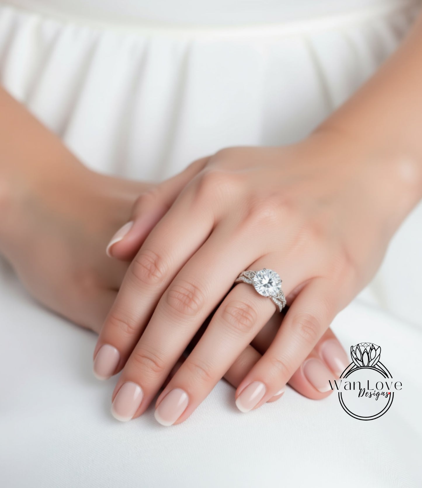 A close-up of a person's hand wearing a large diamond engagement ring.
