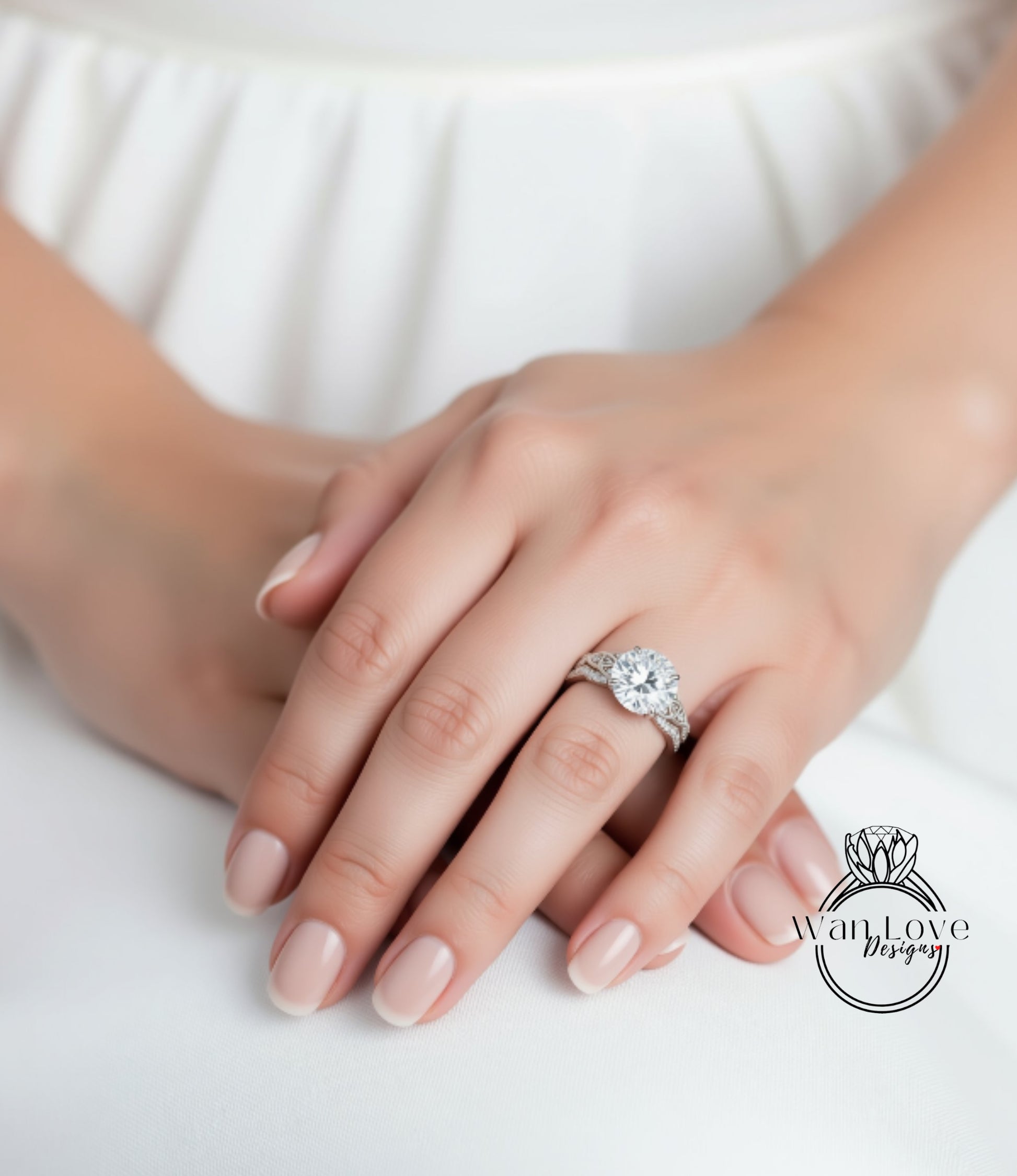 A close-up of a person's hand wearing a large diamond engagement ring.