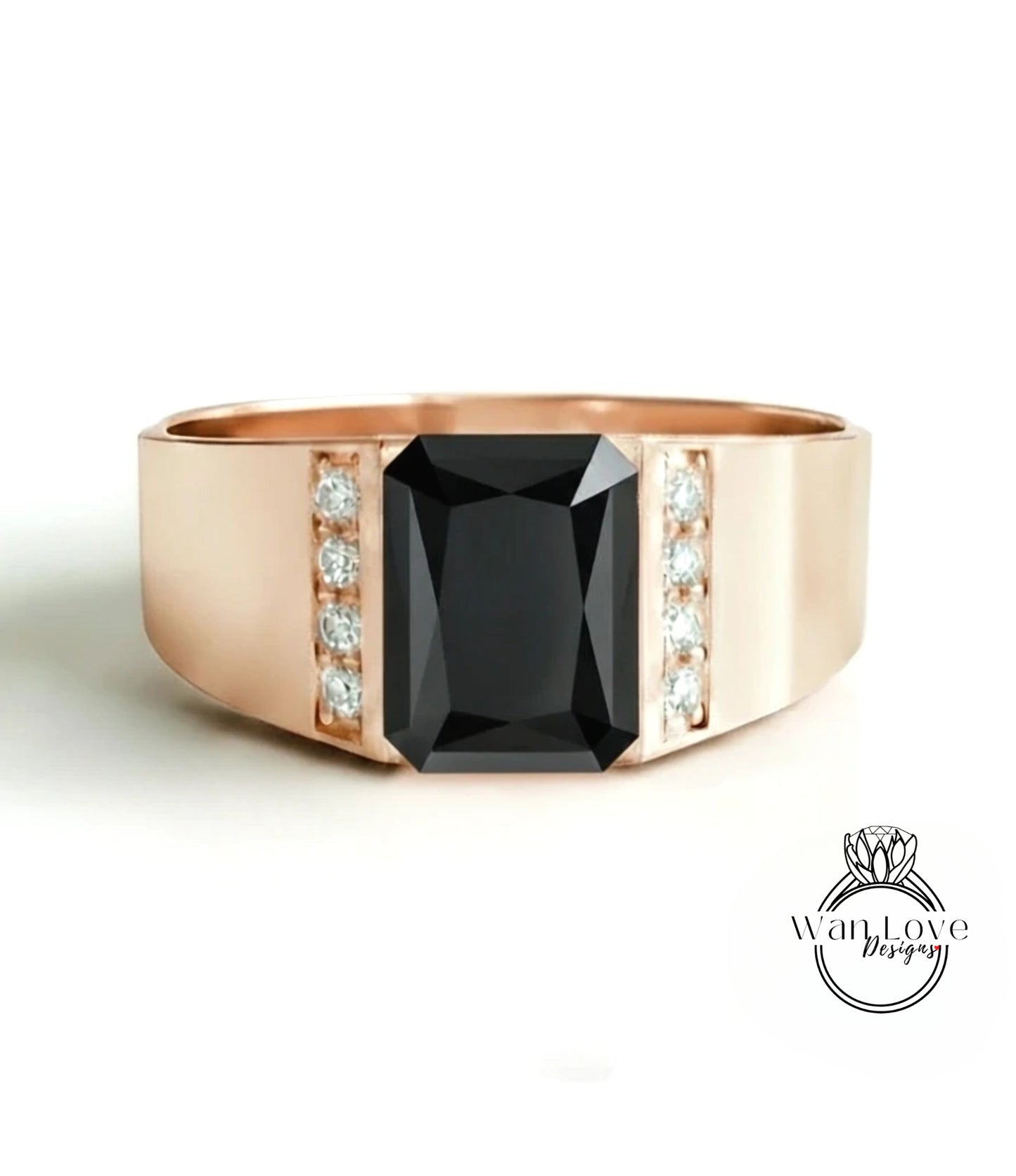 A gold ring with a large black gemstone in the center, surrounded by smaller diamonds.