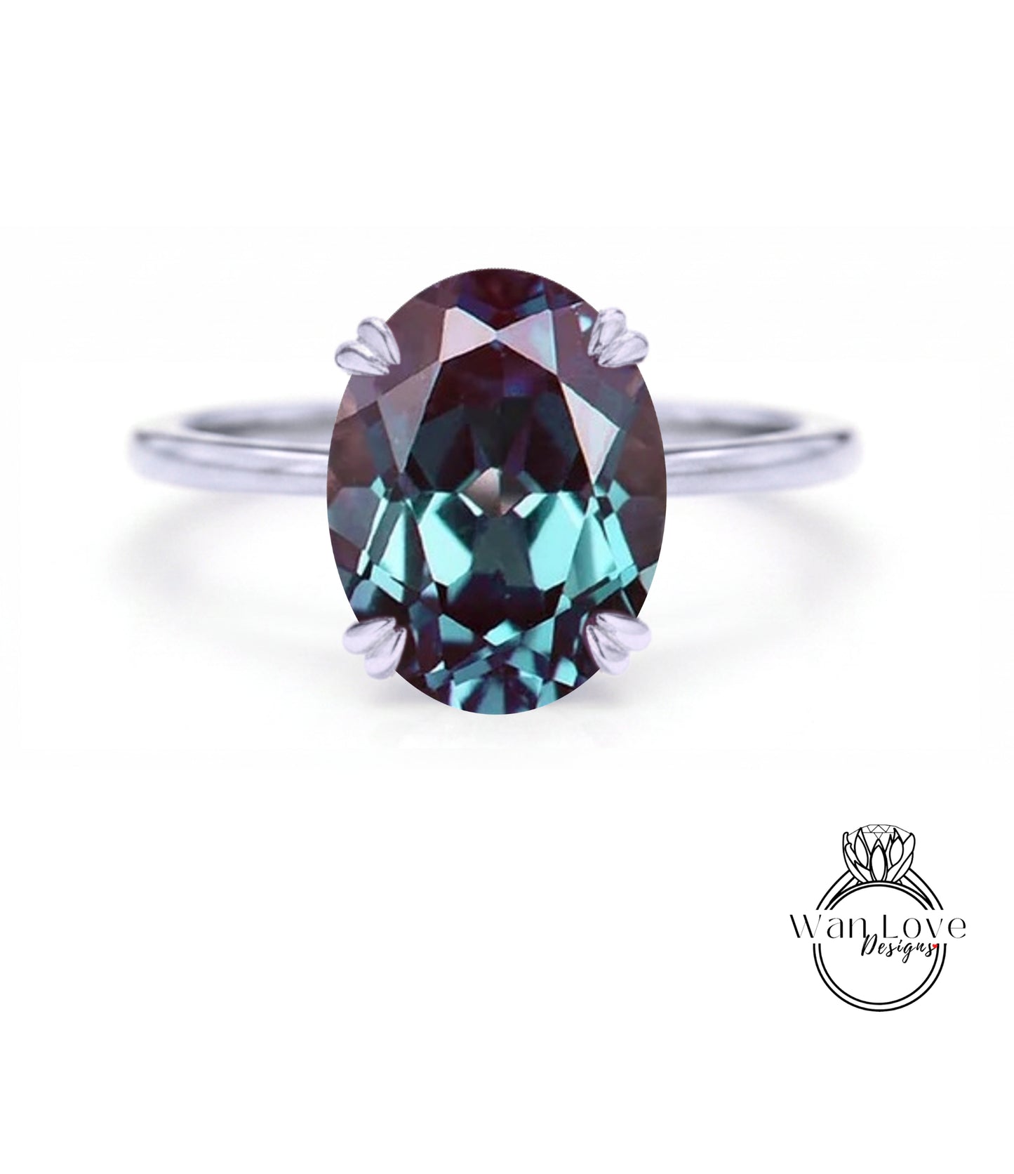 A close-up image of a ring featuring a large oval-shaped gemstone, likely a sapphire, set in a silver band.