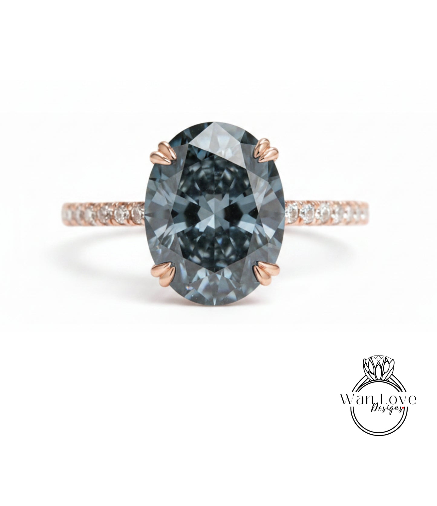 A close-up of a large, dark blue diamond ring with a rose gold band and small diamonds around the band.