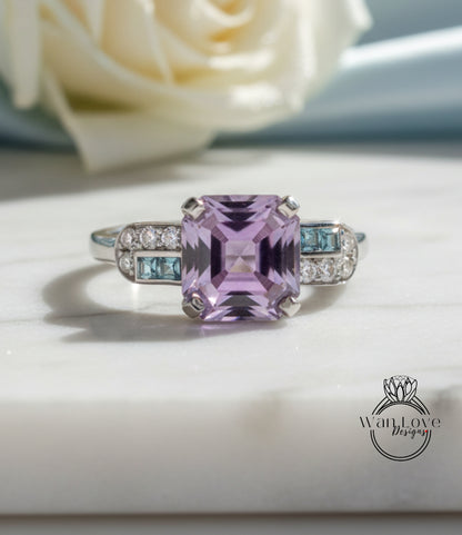 A ring with a large purple gemstone, likely a purple topaz, surrounded by smaller blue gemstones.