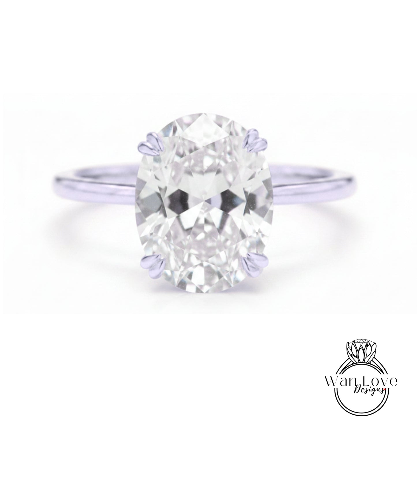 A close-up of a diamond engagement ring with a large oval-shaped diamond set in a silver band.