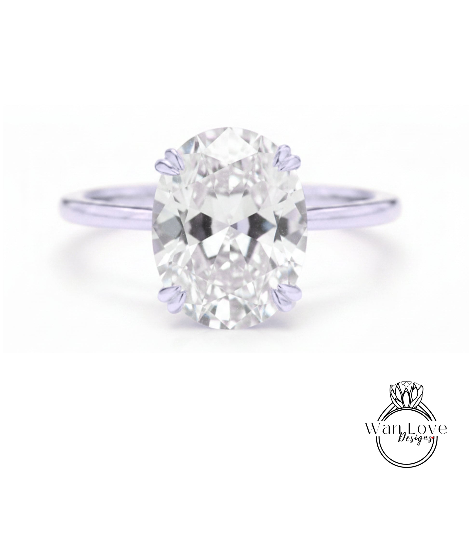 A close-up of a diamond engagement ring with a large oval-shaped diamond set in a silver band.