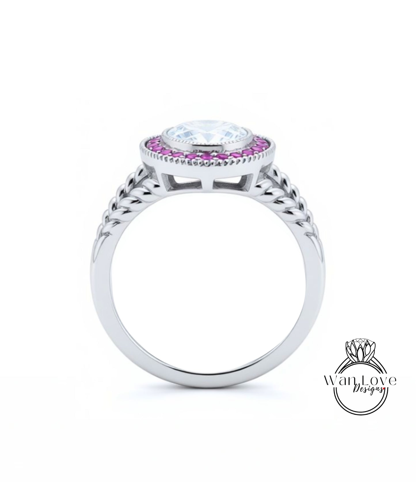 A silver ring with a large central gemstone surrounded by smaller stones, and a decorative band with braided patterns.