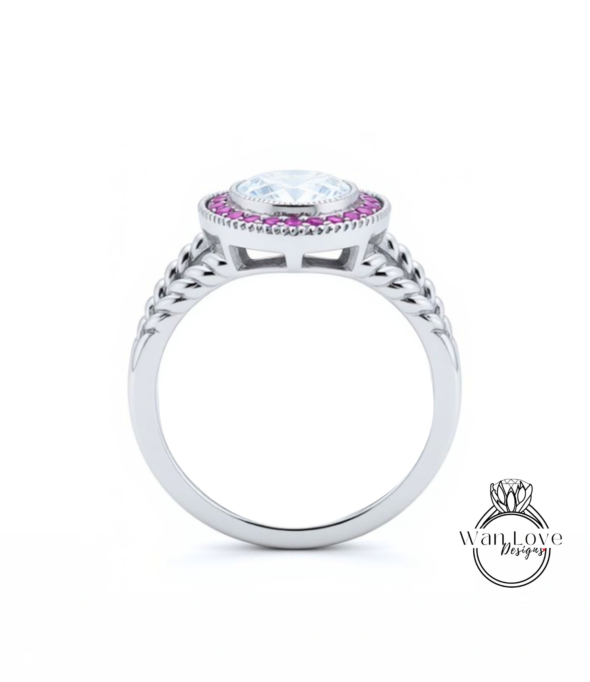 A silver ring with a large central gemstone surrounded by smaller stones, and a decorative band with braided patterns.