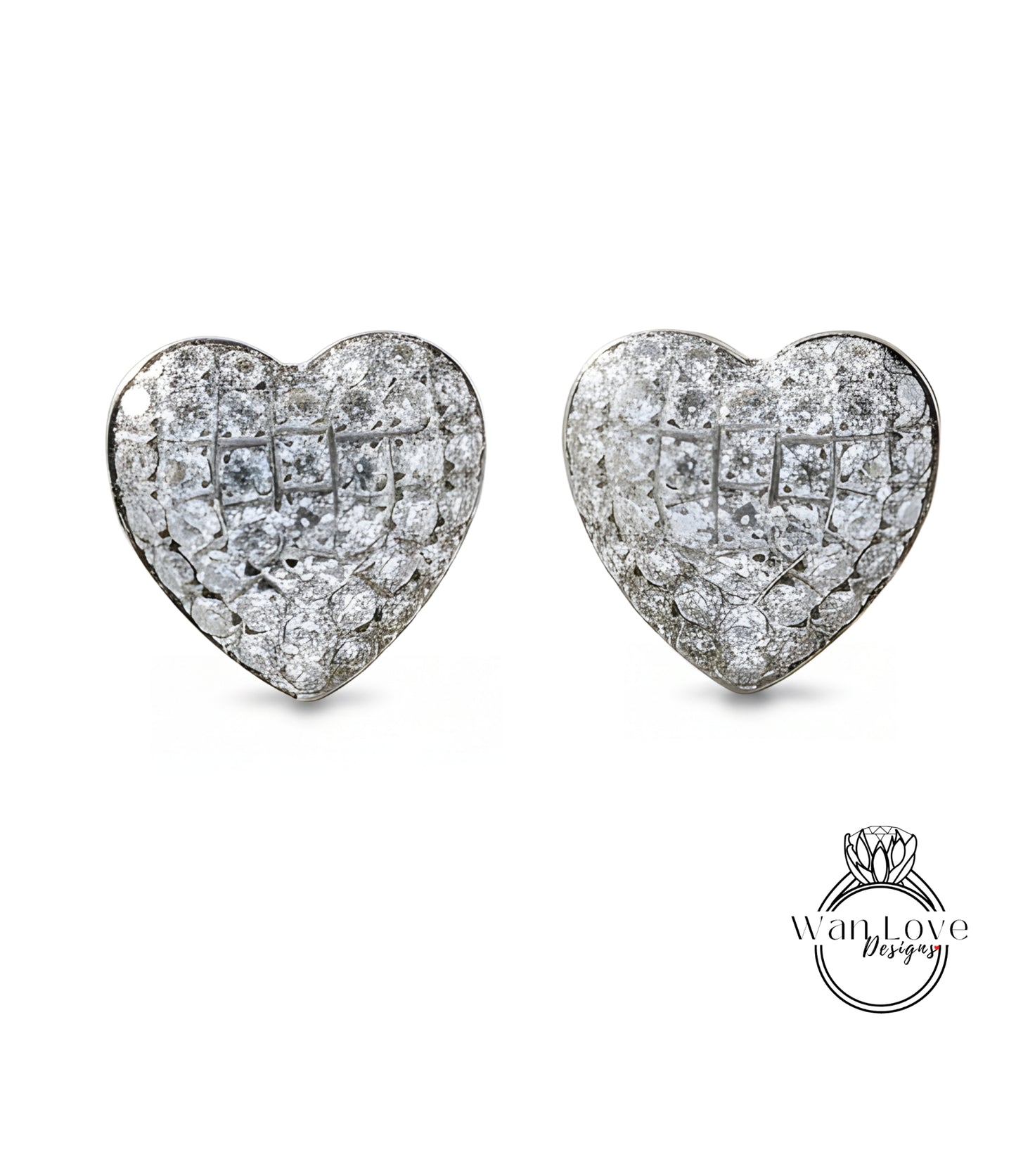 A pair of elegant diamond-encrusted earrings in the shape of hearts.