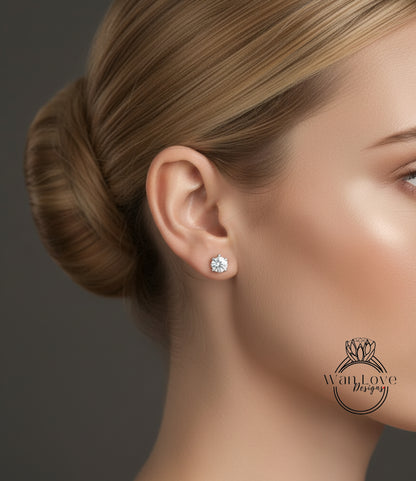 A close-up of a woman's face, focusing on her ear with a diamond earring.