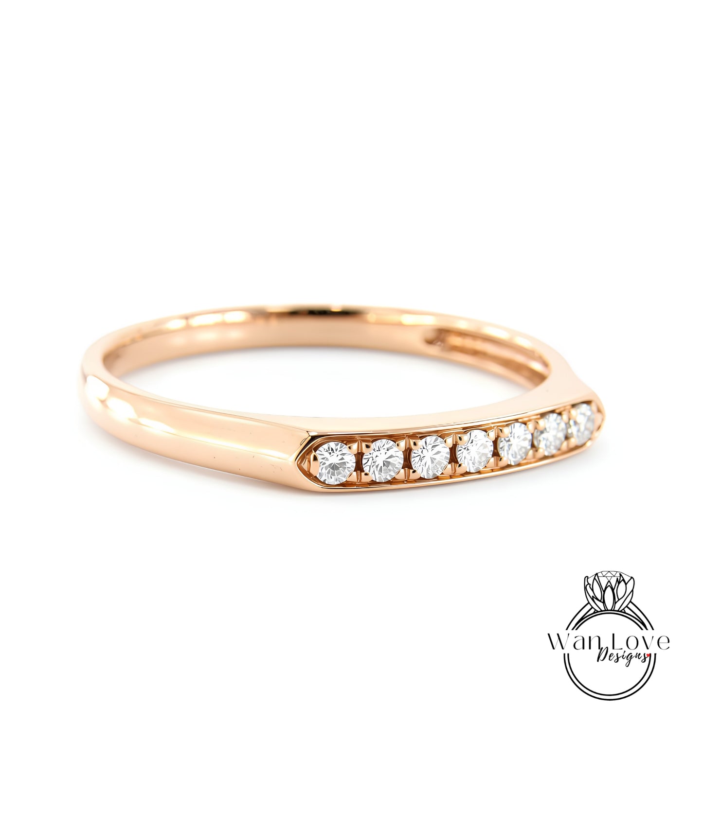 A gold ring with a row of diamonds set in the band.