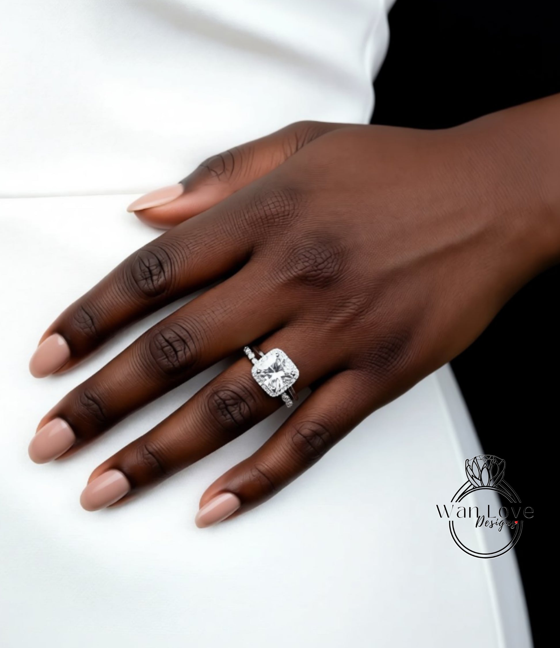 A close-up of a hand wearing a large diamond engagement ring.