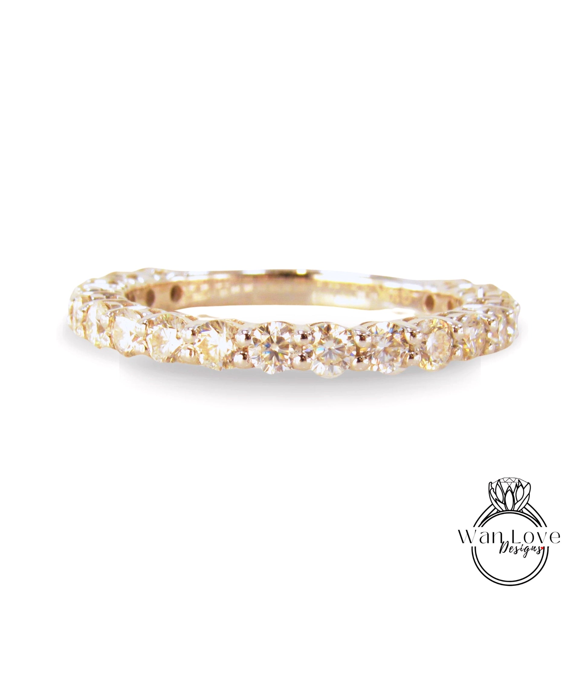 A gold band ring with a row of small diamonds set in it.