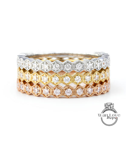 A close-up view of a ring with multiple layers of rings stacked on top of each other, showcasing the intricate design and sparkling diamonds.