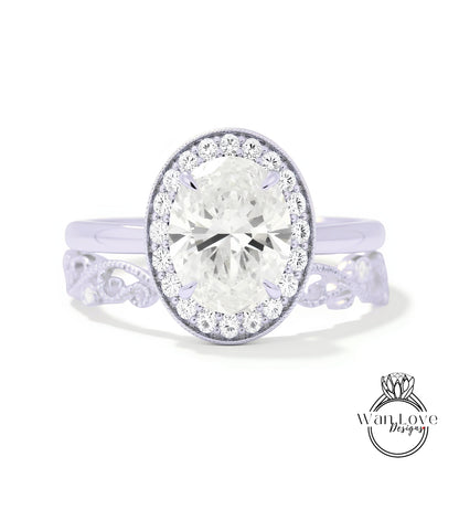 A close-up view of a diamond engagement ring with a large round diamond set in a halo of smaller diamonds, surrounded by a delicate floral band.