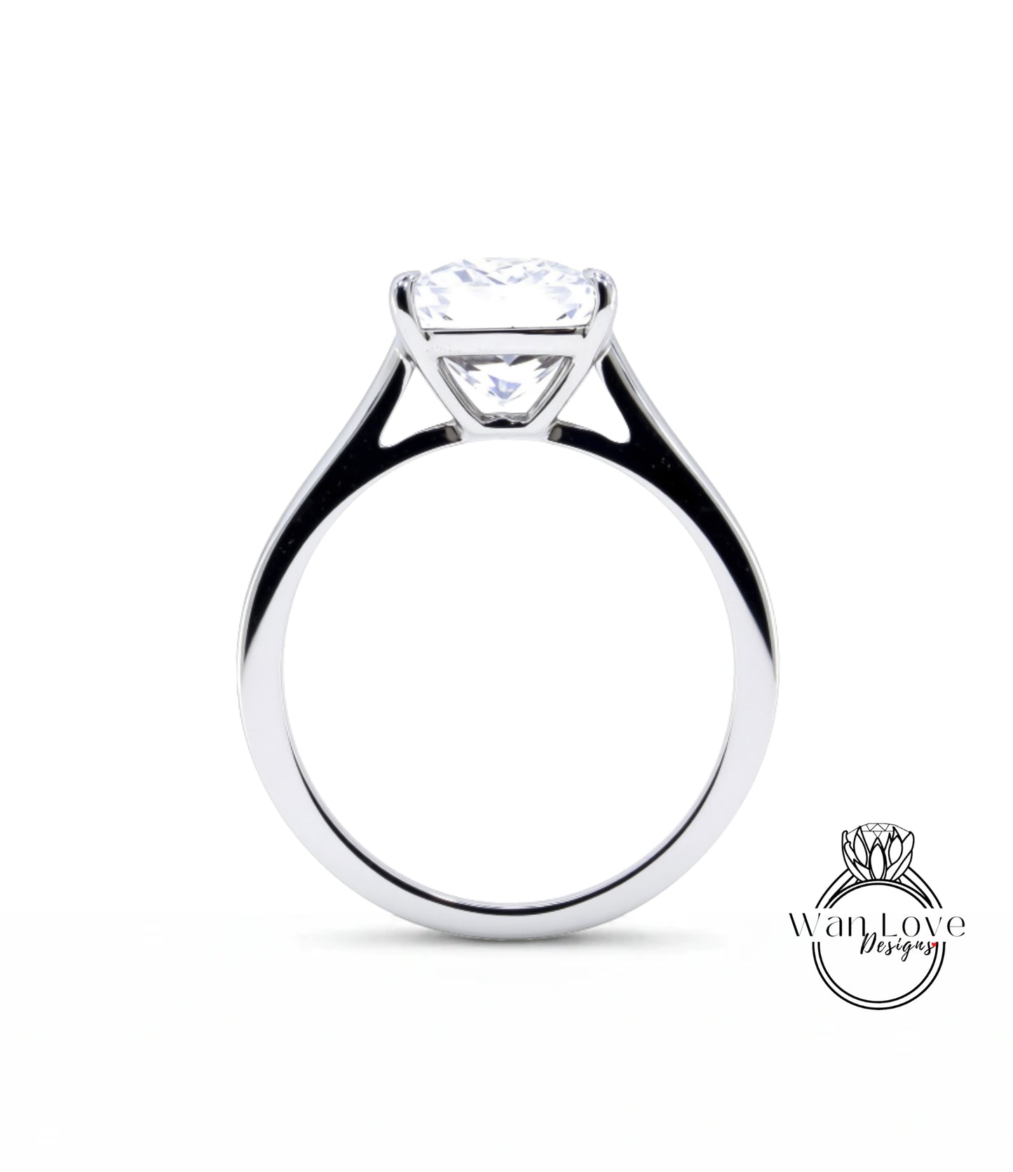 A silver engagement ring with a large, clear diamond set in the center of the band.