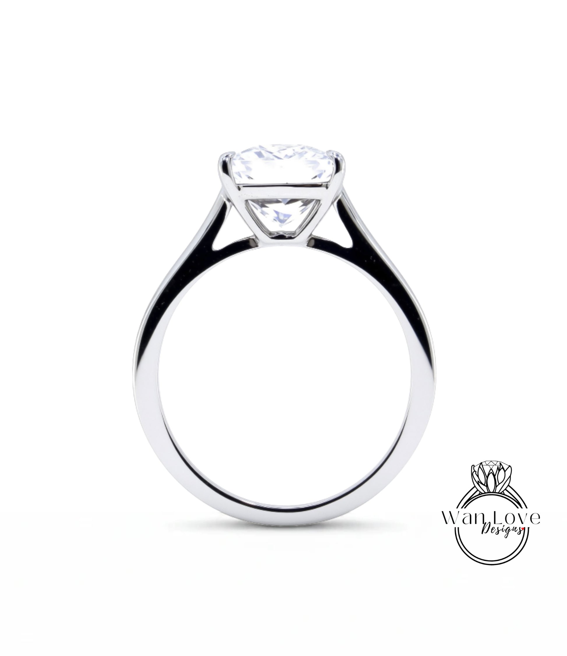 A silver engagement ring with a large, clear diamond set in the center of the band.