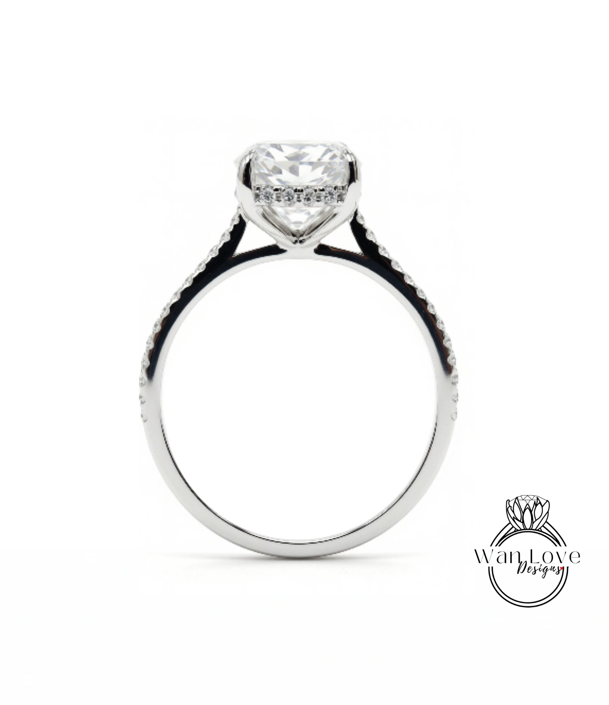 A close-up view of a silver engagement ring with a large, clear gemstone set in the center.