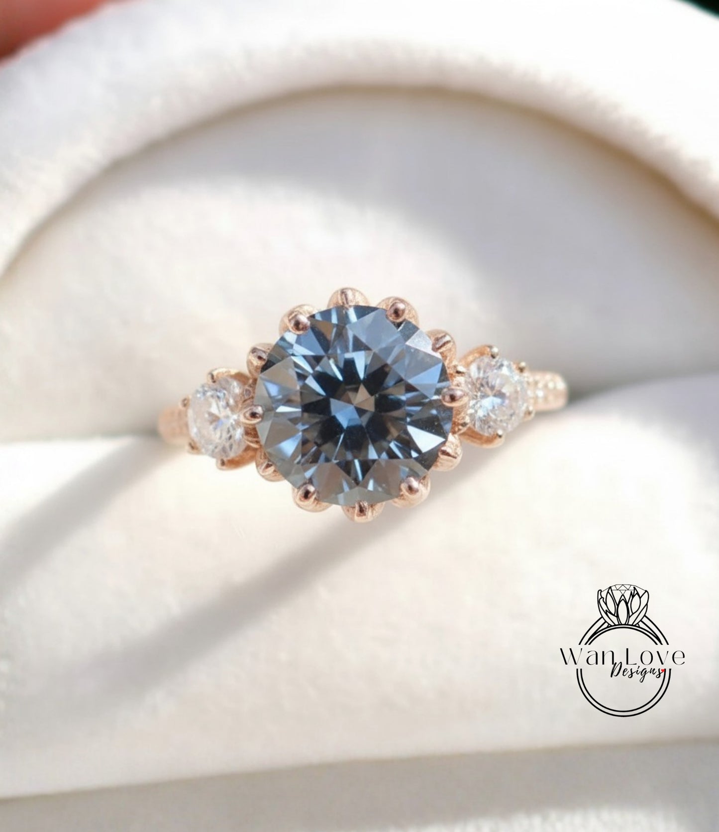 A close-up image of a gold ring with a large blue gemstone, showcasing the intricate details and craftsmanship of the jewelry.