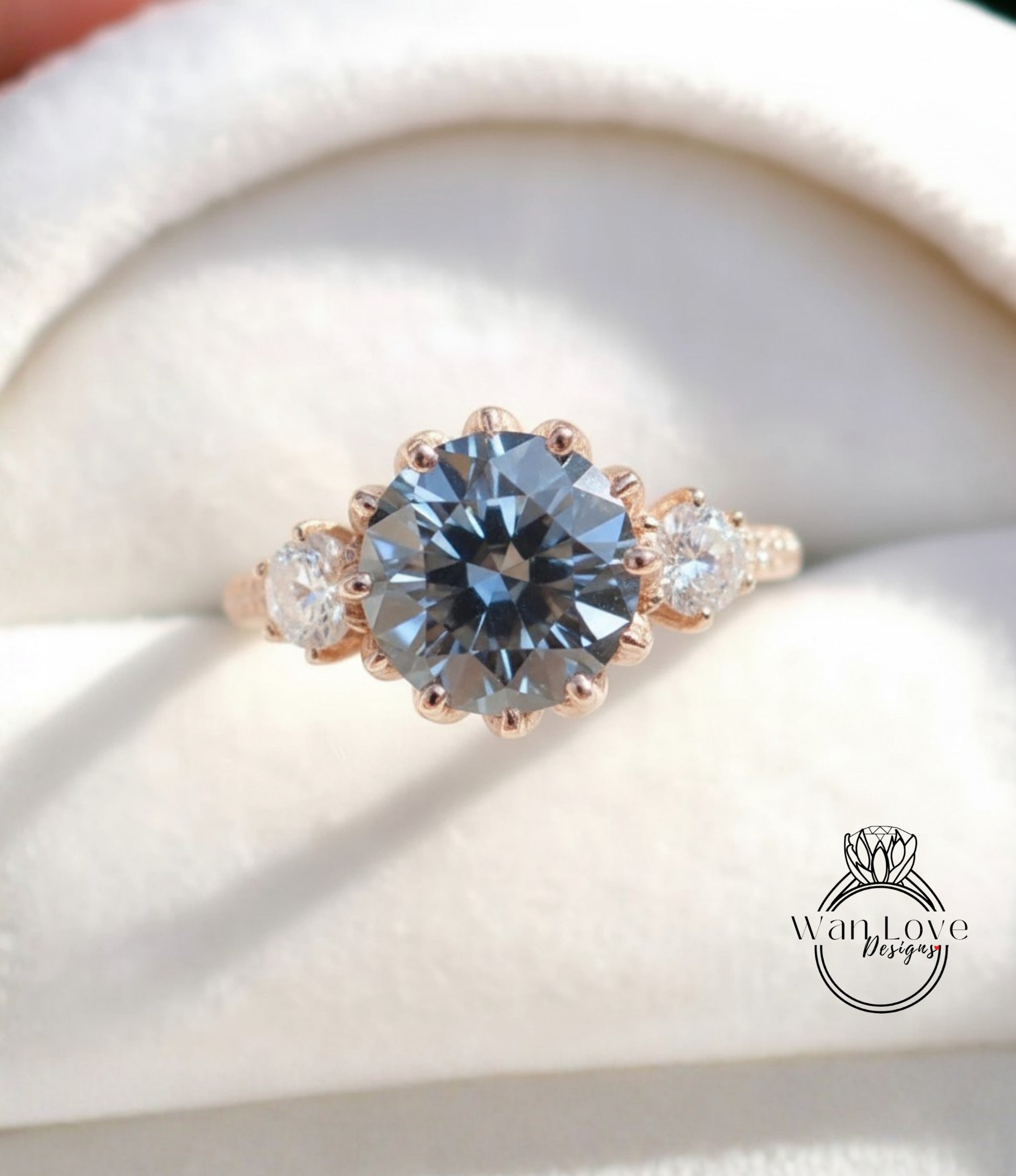 A close-up image of a gold ring with a large blue gemstone, showcasing the intricate details and craftsmanship of the jewelry.