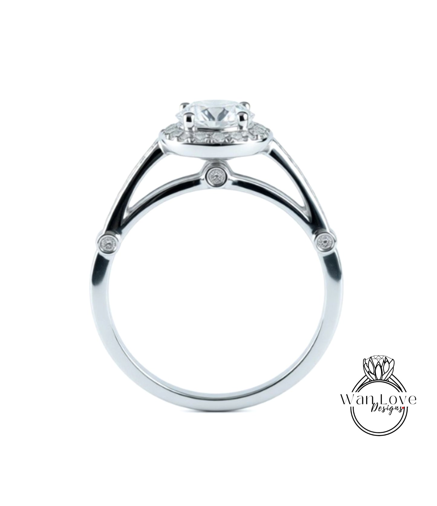 A silver engagement ring with a large central diamond surrounded by smaller diamonds.