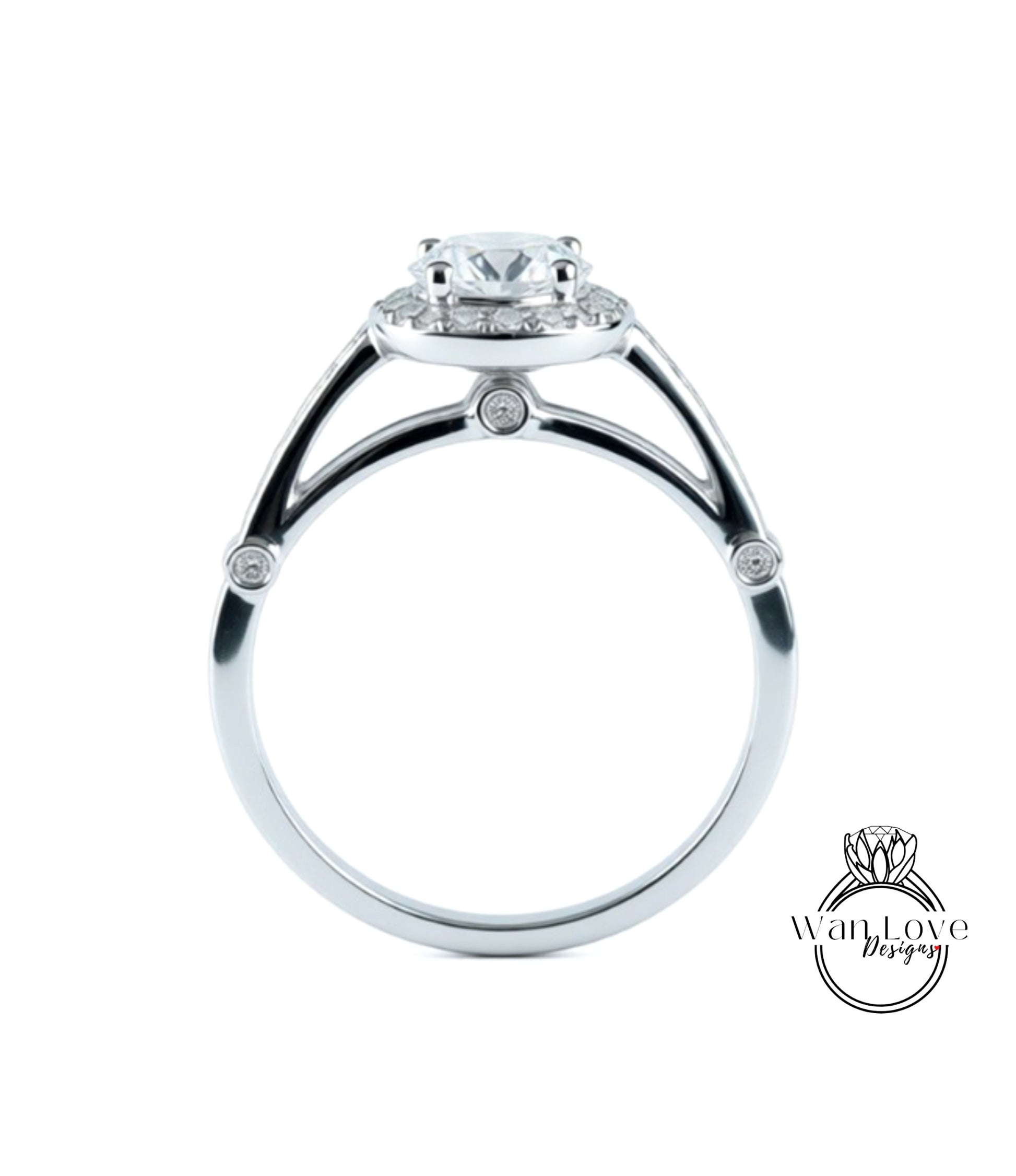 A silver engagement ring with a large central diamond surrounded by smaller diamonds.