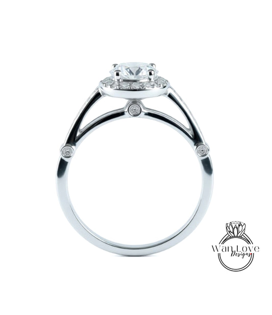 A silver engagement ring with a large central diamond surrounded by smaller diamonds.