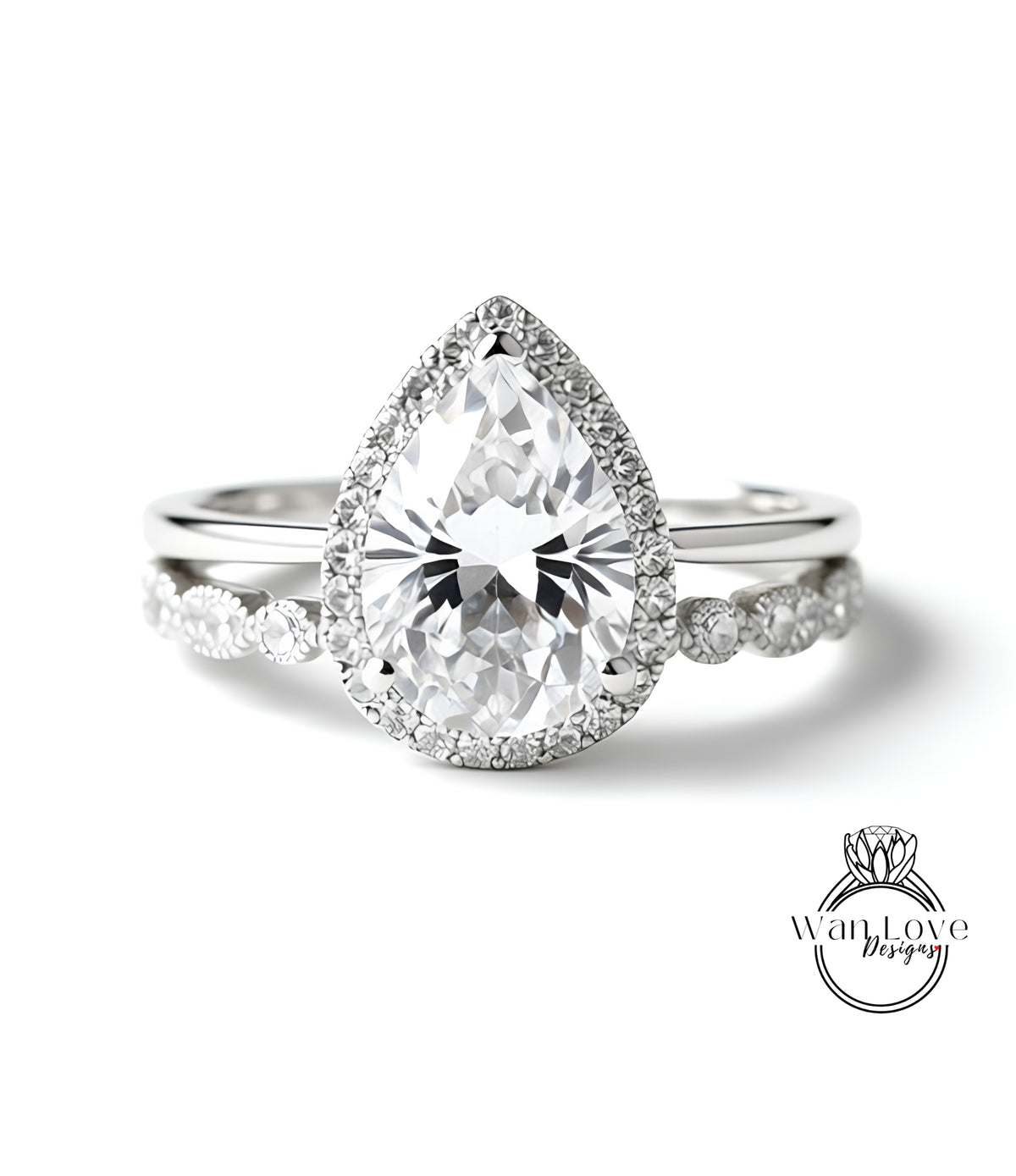 A close-up of a diamond engagement ring with a large pear-shaped diamond set in a halo of smaller diamonds, surrounded by a band of smaller diamonds.