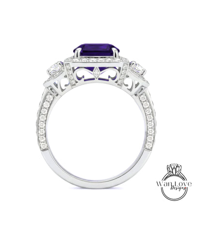 A silver ring with a large purple gemstone, surrounded by smaller diamonds and intricate designs.